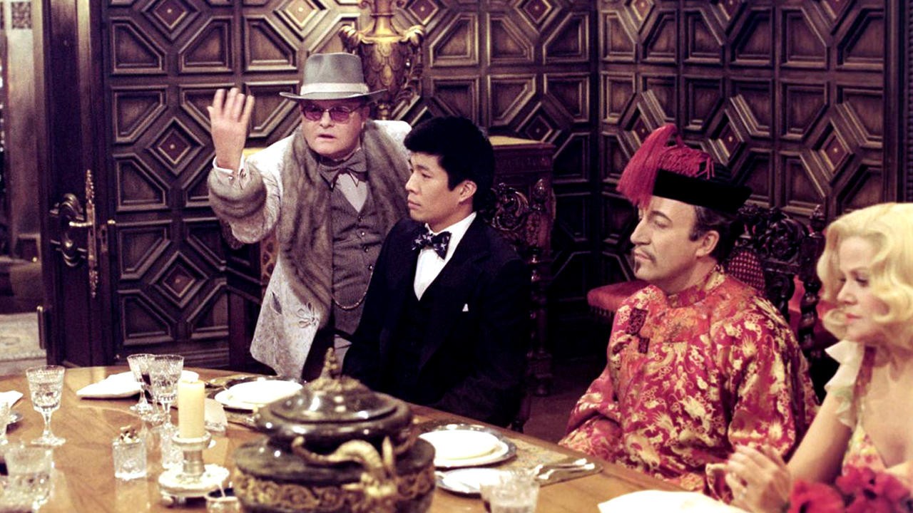 Filme: "Um Convidado Bem Trapalhão" (1976), Robert Moore